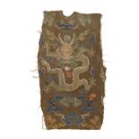 A Chinese zhijin embroidered silk fragmentary panel depicting a front facing five clawed dragon,
