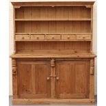 Property of a gentleman - a Continental pine two-part dresser, 64.2ins. (163cms.) wide.