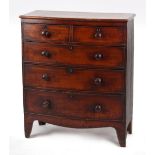 Property of a gentleman - an early 19th century mahogany bow-fronted chest of two short & three long
