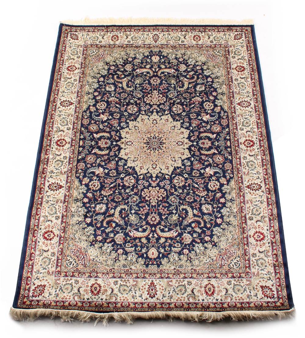 A Kashan style rug with blue ground, 79 by 55ins. (200 by 140cms.).