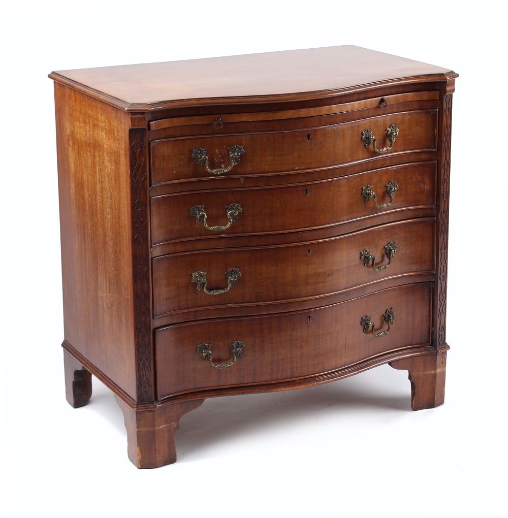 Property of a deceased estate - an early 20th century mahogany serpentine fronted chest of four long