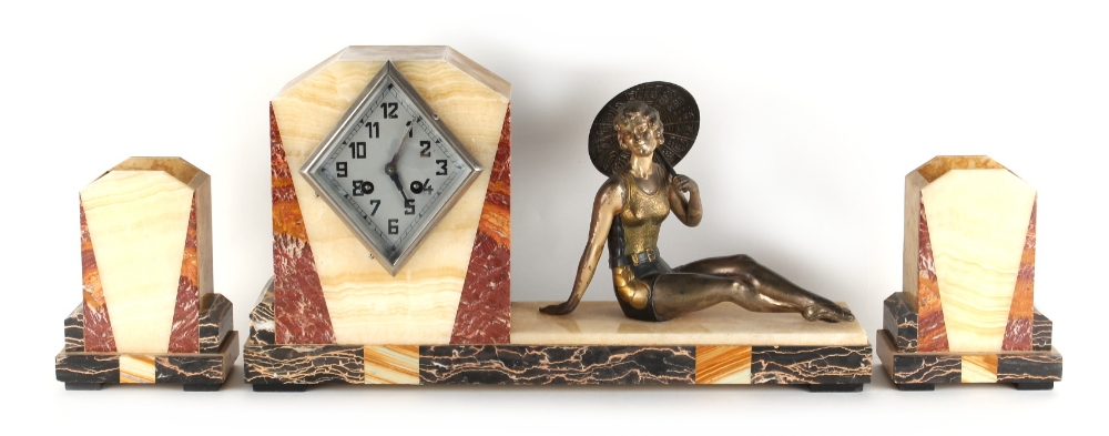 Property of a gentleman - an Art Deco marble & onyx three piece mantel clock garniture, the clock