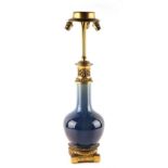 A Chinese flambe glazed bottle vase, 19th century, adapted as a table lamp with ormolu mounts, 25.