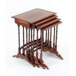 Property of a deceased estate - a nest of four mahogany occasional tables with turned supports,