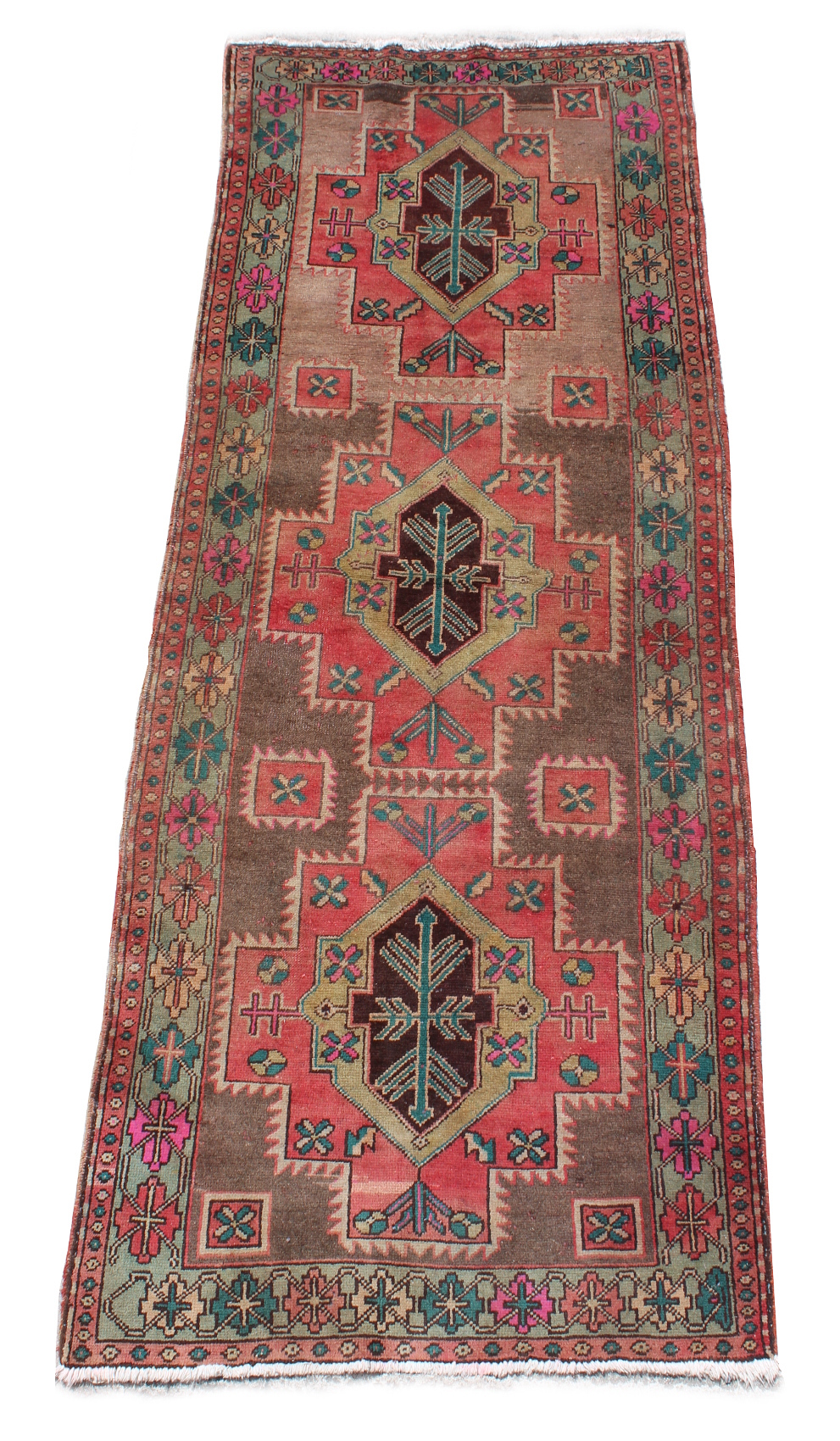 An Esari woollen hand-made carpet with beige ground, 115 by 44ins. (290 by 110cms.).