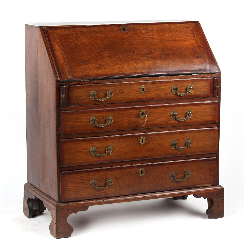 Property of a lady - a George III oak & mahogany fall-front bureau, with four long graduated