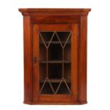 Property of a gentleman - an early 19th century mahogany astragal glazed corner wall cabinet.