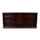 Property of a lady - a mahogany dwarf open bookcase, with partitions, on plinth base, 78ins. (