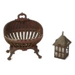 Property of a deceased estate - a cast iron shell shaped fire basket; together with a copper porch