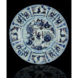 Property of a lady - an 18th century English delft charger or shallow dish, painted in blue &