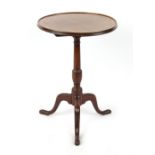 Property of a deceased estate - a George III mahogany dished circular tilt-top occasional table,