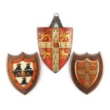 Property of a gentleman - two tole peinte or toleware heraldic shields, probably 19th century,
