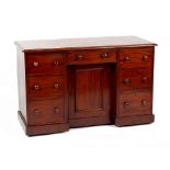 Property of a gentleman - a Victorian mahogany kneehole desk, with turned handles, 47.7ins. (
