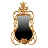 Property of a lady - a small George II/III style carved giltwood wall mirror, 28ins. (71cms.) high.