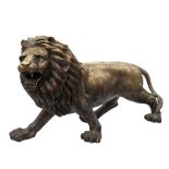 Property of a gentleman - a massive bronze model of a prowling lion, after the model by Antoine-