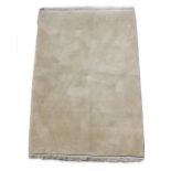 A Gabbeh woollen hand-made rug with beige ground, 56 by 38ins. (140 by 95cms.).