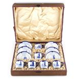 Property of a lady - a set of six early 20th century Royal Crown Derby blue & white coffee cans &