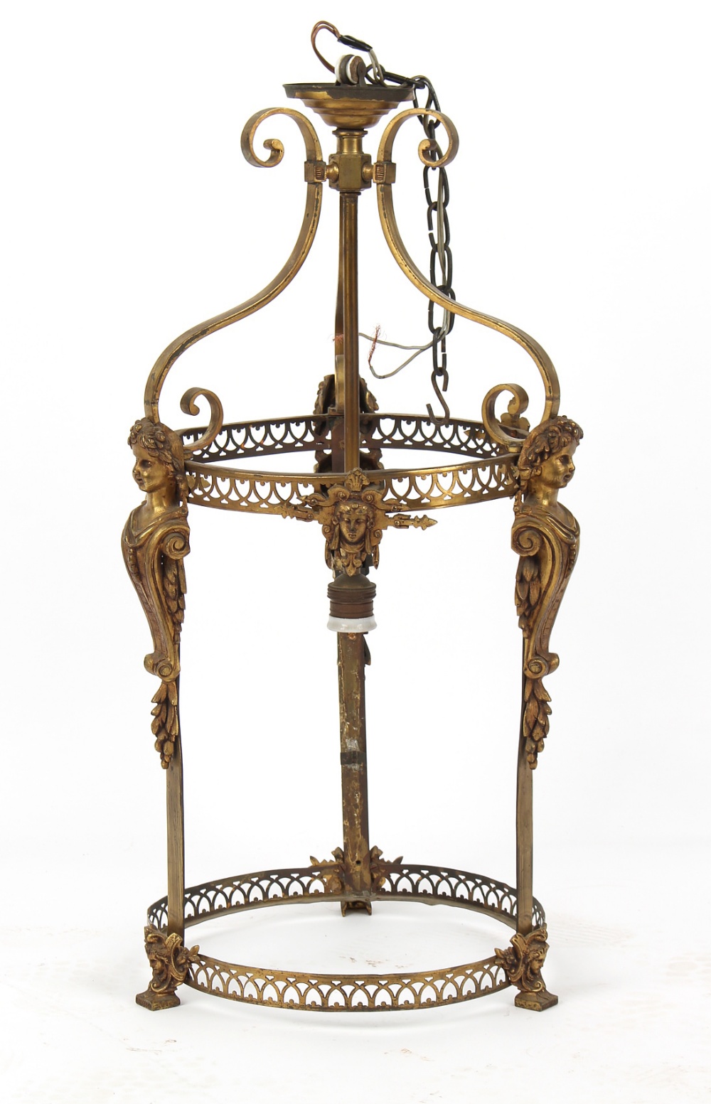 A late 19th century brass cylindrical hall lantern with cast female masks, the glass missing, 27ins.