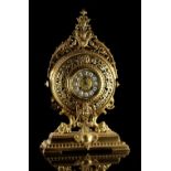 Property of a deceased estate - a late 19th century French ornate brass cased mantel clock, the dial