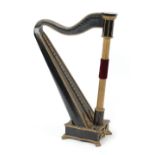 Property of a lady - a late 19th century ebonised & parcel gilt Welsh harp, strings absent,