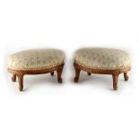 Property of a gentleman - a pair of Victorian walnut oval footstools, with cabriole legs (2).