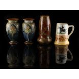 Property of a lady - a pair of Royal Doulton stoneware baluster vases, each 7ins. (17.8cms.) high;