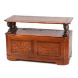 Property of a deceased estate - a reproduction oak monk's bench with carved lion supports, 43ins. (