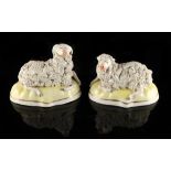 Property of a lady - a pair of 19th century Staffordshire porcelain models of a recumbent ram and
