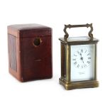 Property of a deceased estate - an early 20th century brass cased carriage clock timepiece, the