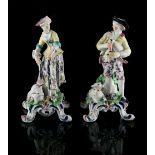 Property of a deceased estate - a pair of polychrome decorated porcelain figures of a Shepherd and