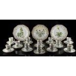 A set of twelve porcelain Flora Danica small mugs & saucers, together with three matching decahedral