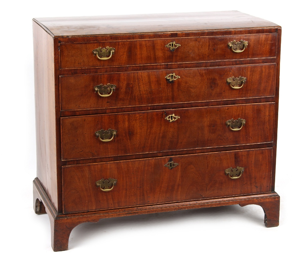 Property of a gentleman - a George II walnut caddy top chest of four long graduated drawers, with