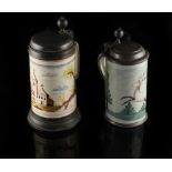 Two late 18th / early 19th German pewter mounted fayence lidded tankards, one painted with a