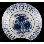 Property of a lady - an 18th century Dutch Delft barber's bowl, painted with flowers, 9ins. (23cms.)
