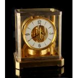 Property of a lady - a Jaeger Le Coultre Atmos clock, numbered 33210, 9.25ins. (23.5cms.) high.
