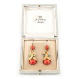 An attractive pair of yellow metal coral & turquoise leaf & berry pendant earrings, marked COC