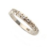 Property of a gentleman - an 18ct white gold diamond half eternity ring, approximately 2.9 grams,