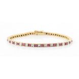 An 18ct yellow gold ruby & diamond box link bracelet, the square cut rubies weighing an estimated