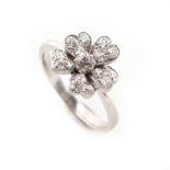 An unmarked white gold diamond flowerhead ring, the estimated total diamond weight 0.60 carat,