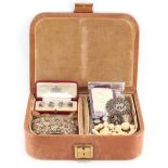 Property of a gentleman - a tan leather jewellery box containing assorted costume jewellery