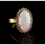 Property of a lady - a 14ct yellow gold opal & diamond oval cluster ring, 15mm by 9mm by 3.8mm,