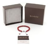 Property of a lady - a Gucci San Valentino silver & red painted wooden bead bracelet, in original