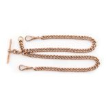 Property of a lady - a 9ct gold watch chain, with two swivels & T-bar, approximately 30.6 grams.