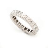 Cartier - a platinum diamond eternity ring by Cartier, set with sixteen round brilliant cut