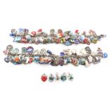 Property of a gentleman - two silver charm bracelets with enamel charms, mostly silver,