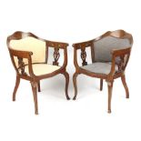 Property of a lady - a pair of Edwardian marquetry inlaid salon tub chairs (2).