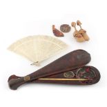 A set of opium scales, in wooden paddle shaped case; together with a bone fan; and a Kobe toy (3).