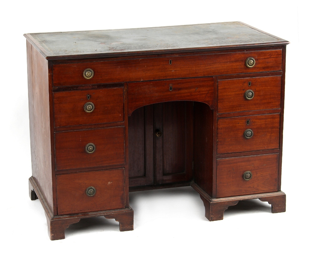 Property of a gentleman - an early George IV mahogany kneehole desk, with green leather inset top