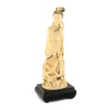 Property of a lady - an early 20th century Chinese carved ivory figure of Guanyin, 10ins. (25.4cms.)