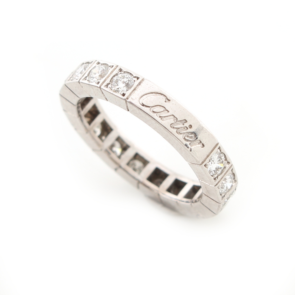 Cartier - a platinum diamond eternity ring by Cartier, set with sixteen round brilliant cut